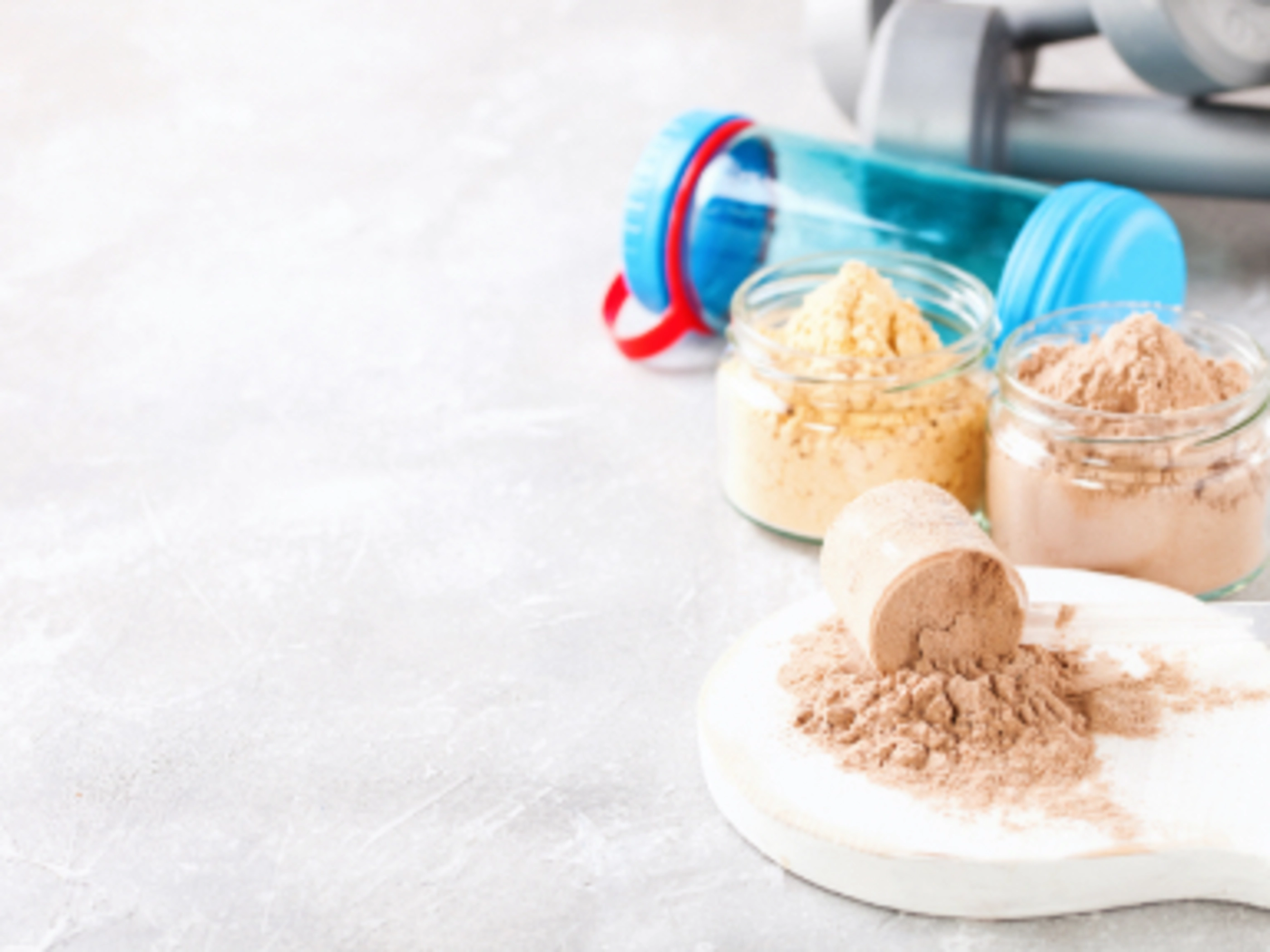 several containers of protein powder