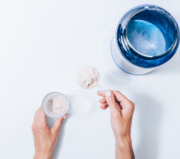 a person scooping white powder
