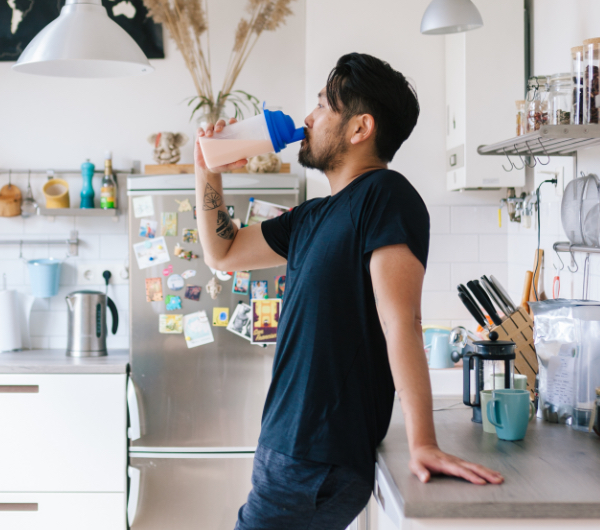 a man drinking a shake