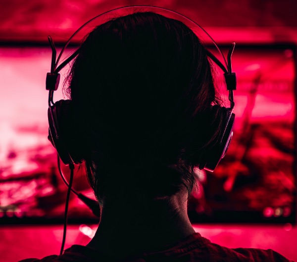 silhouette of a woman wearing a headset