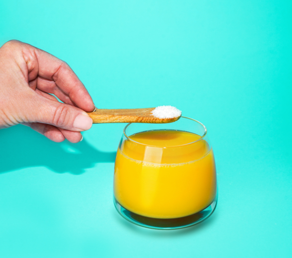 glass of orange juice on a blue background
