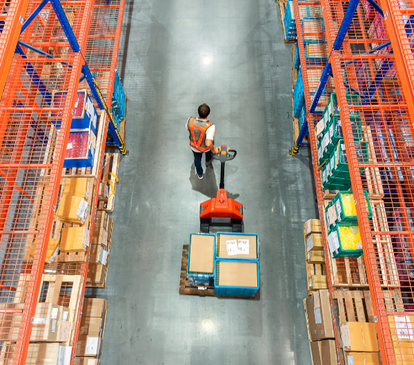 boxes pulled on dolly in warehouse