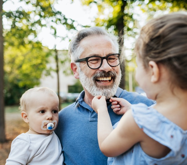 a man laughing with children