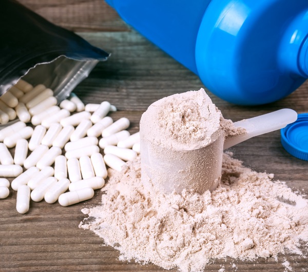 chocolate powder in a clear plastic scoop